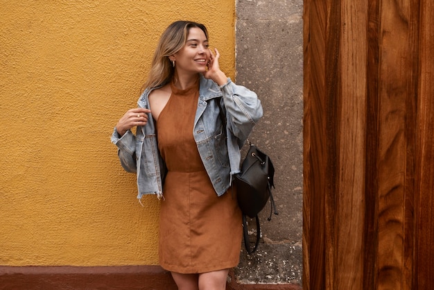 Front view smiley woman posing outdoors