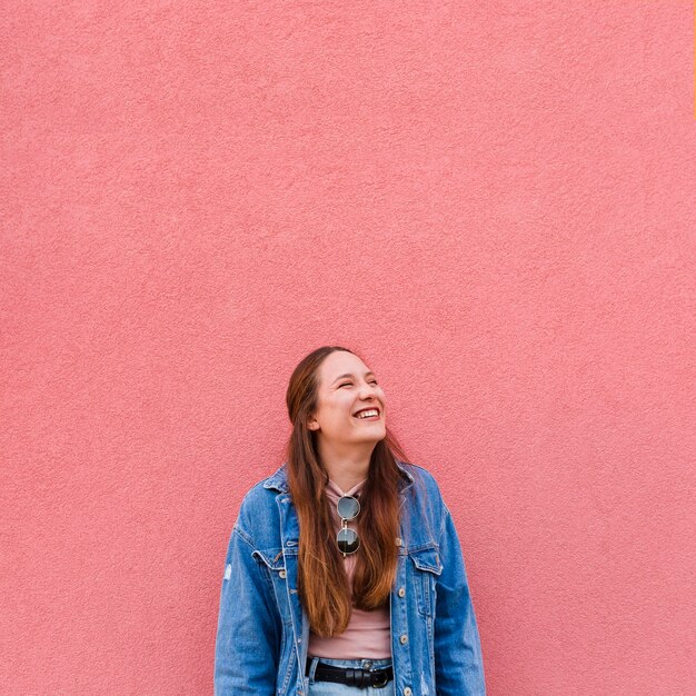 Front view of smiley woman posing with copy space