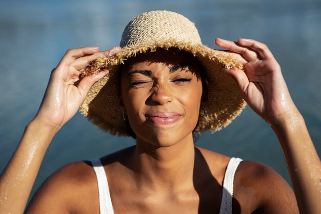 Front view smiley woman wearing hat