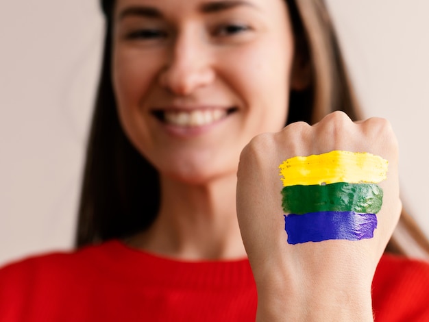 Free Photo front view smiley woman with brazilian flag