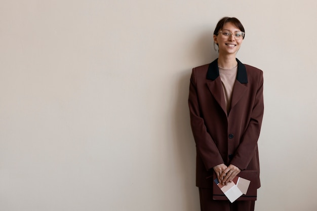 Free photo front view smiley woman with copy space