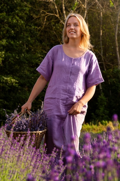 Front view smiley woman with lavender basket