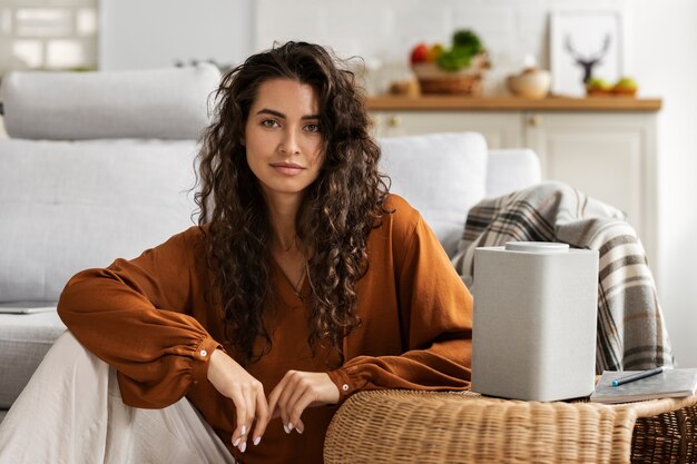 Front view smiley woman with smart speaker