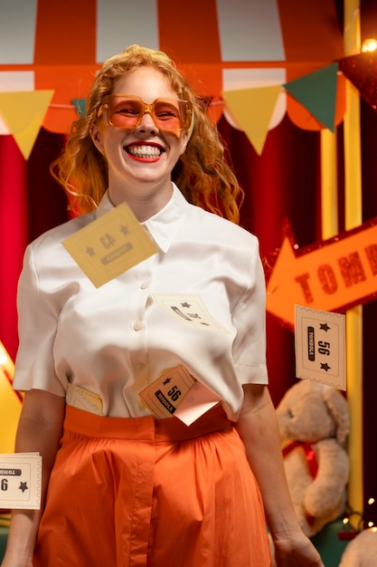 Free photo front view smiley woman with tombola tickets