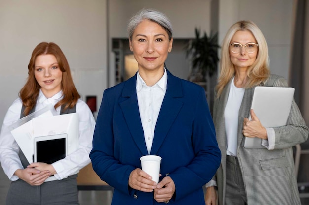 Free Photo front view smiley women at work