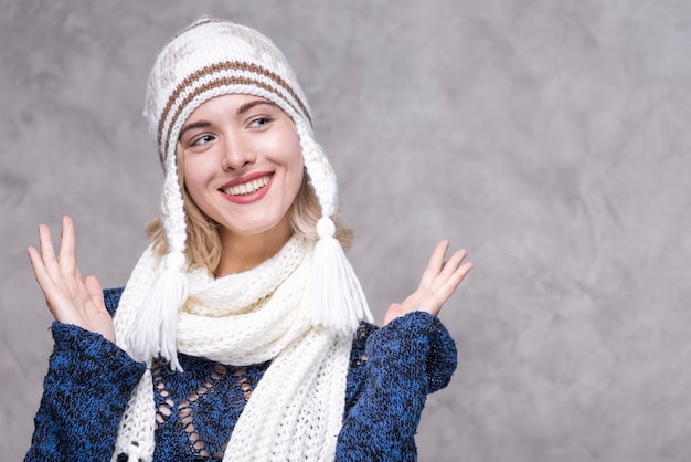 Front view smiley young woman with hat