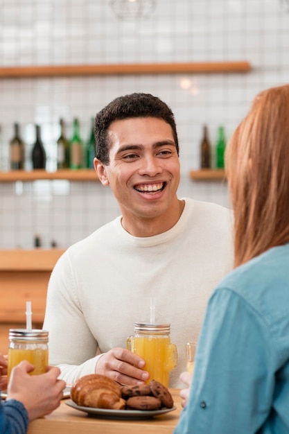 Front view of smiling boy in cafe