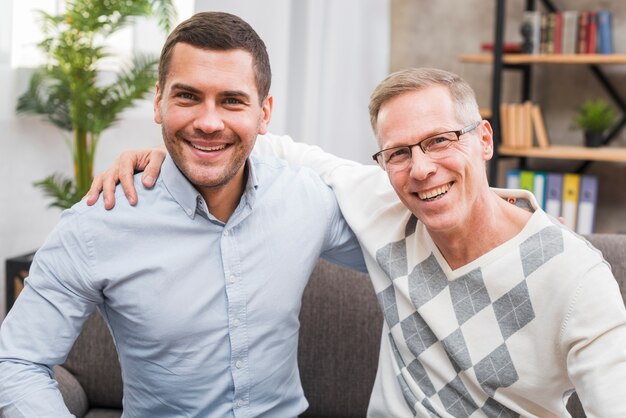 Front view of smiling father and son