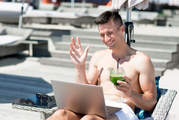 Front view of smiling man at beach