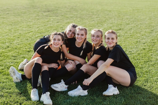 Front view smiling sportive women looking at photographer