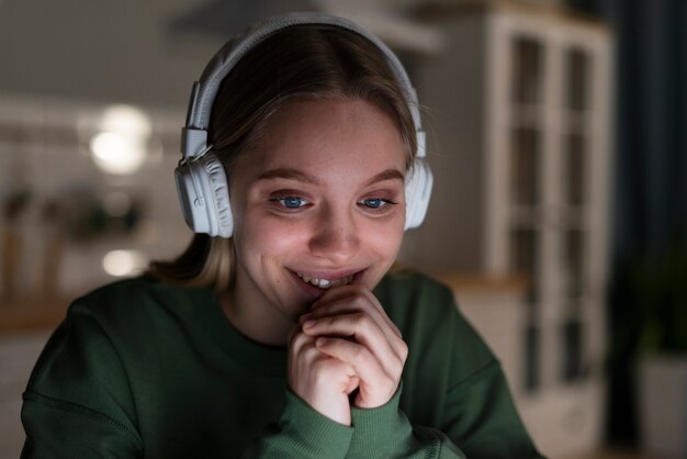 Front view of smiling woman with headphones