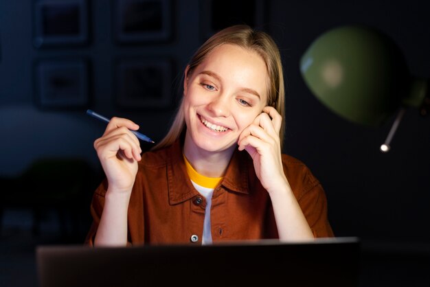 Front view of smiling woman working