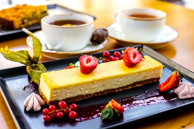 Front view souffle dessert with berries and jam on a tray