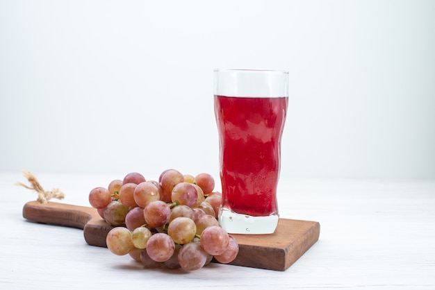 Front view sour fresh grapes with juice on white desk fruits fresh mellow juice drink