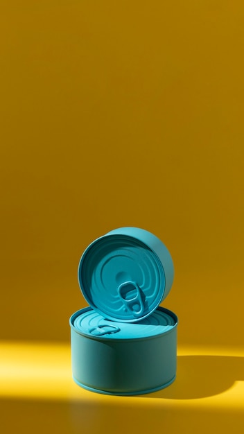 Front view stack of blue round tin cans with copy-space