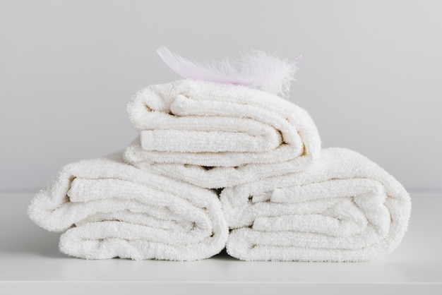 Free Photo front view stacked white towels