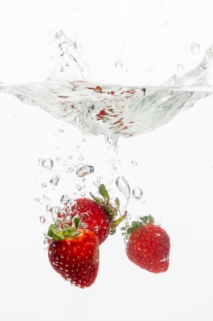 Free photo front view of strawberries in water