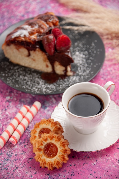 Front view strawberry chocolate cake with cup of tea and cookies on the pink desk sugar sweet biscuit cookie