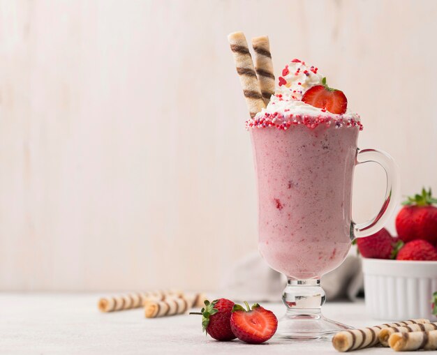 Front view of strawberry milkshake with copy space