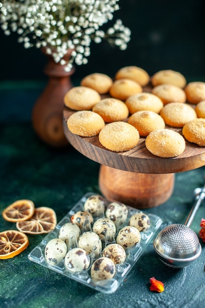 Free Photo front view sweet biscuits with nuts and milk on dark blue surface