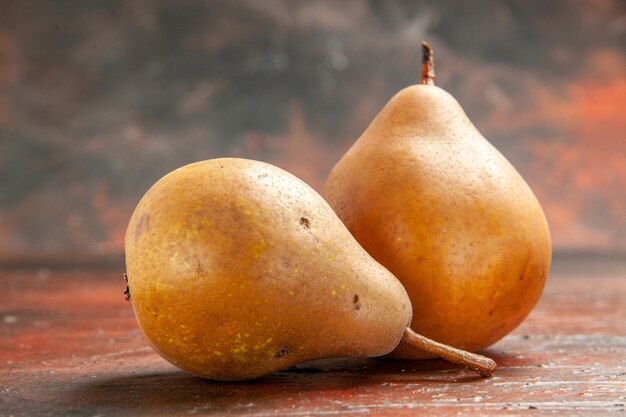 Front view sweet pears on a dark background