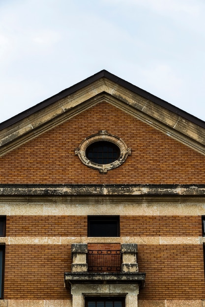 Free Photo front view symmetrical old brick building 