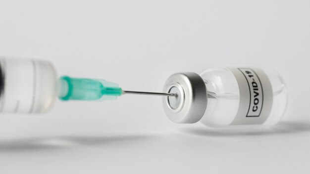 Front view syringe and vaccine bottle