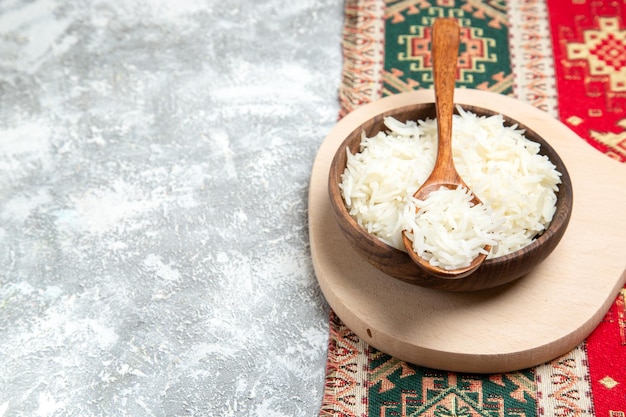 Free Photo front view tasty cooked rice inside brown plate on the white space