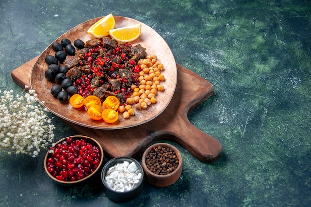 Free photo front view tasty meat slices fried meal with fruits inside plate on dark background