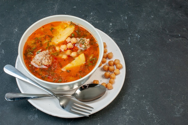 Front view tasty meat soup with beans greens and potatoes on dark table