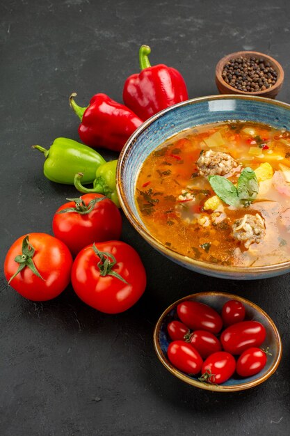 Front view tasty meat soup with fresh vegetables on a dark background