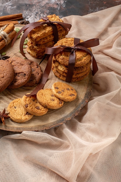 Free Photo front view tasty sweet biscuits with cup of coffee on a light background color cocoa sugar tea cake cookie sweet pie