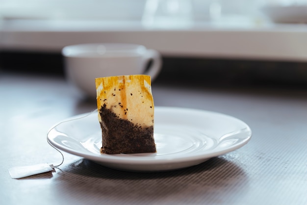 Front view of tea bag with blurred background