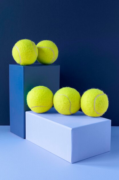 Front view of tennis balls on pedestal shapes