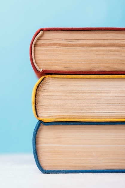 Front view of three colored stacked books