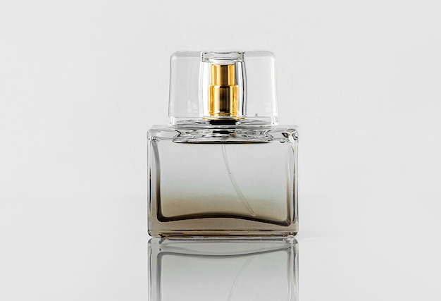 Free photo a front view transparent bottle fragrance isolated on the white wall