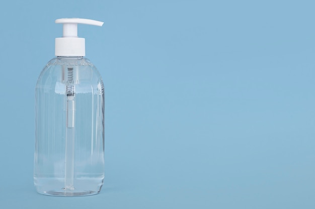 Front view transparent bottle of liquid soap with copy space