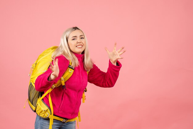 Front view traveler woman with backpack expressing her feeling