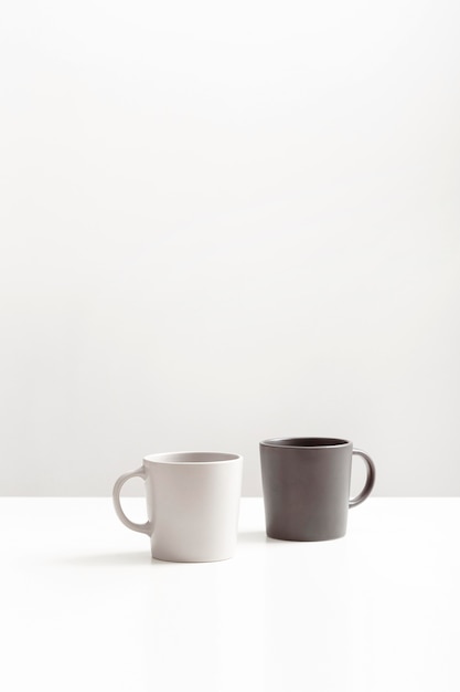 Free Photo front view of two mugs with copy space