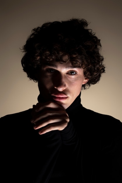 Free Photo front view unknown young man posing in studio