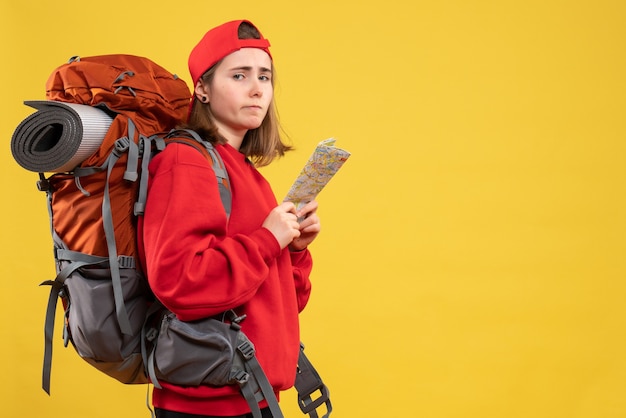 Front view upset female backpacker holding travel map