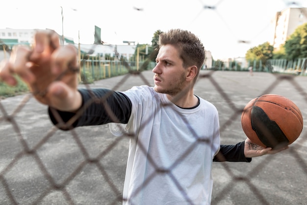 Free photo front view urban basketball player