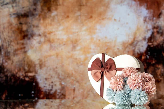 Front view valentines day present with flowers on light brown background color feeling family beauty couple passion love heart free space