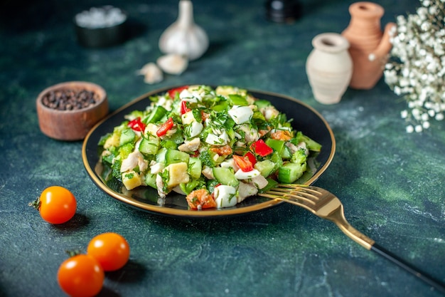 front view vegetable salad consists of cucumber cheese and tomatoes on dark-blue background