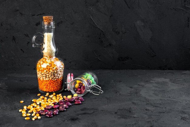 Front view vessel with cereals and dry beans with corn