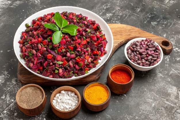 Free Photo front view vinaigrette salad with beet and beans on grey background