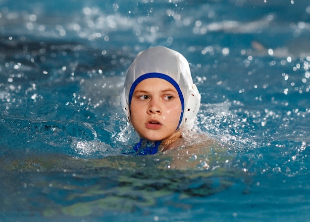 Free photo front view waterpolo  player in pool