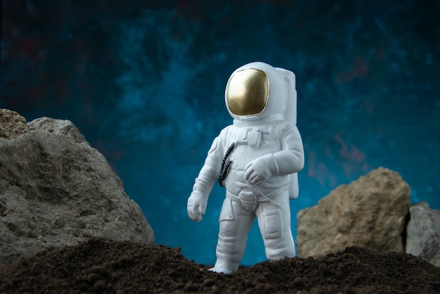 Free photo front view of white astronaut on moon on blue  fantasy sci fi