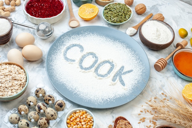 Free Photo front view white flour inside plate with nuts seeds and eggs on white background nut dough bake food color cake biscuit pie cook photo