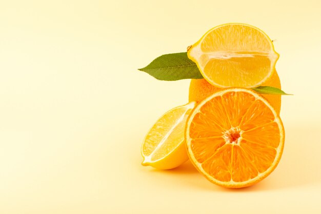 A front view whole orange and sliced piece along with sliced lemon ripe fresh juicy mellow isolated on the cream background citrus fruit orange